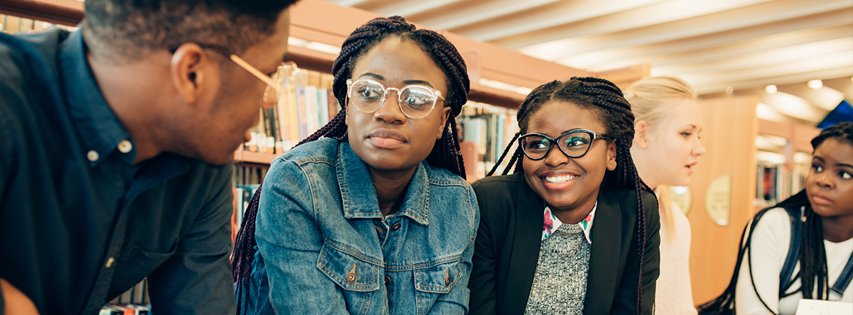 Students collaborating in a library